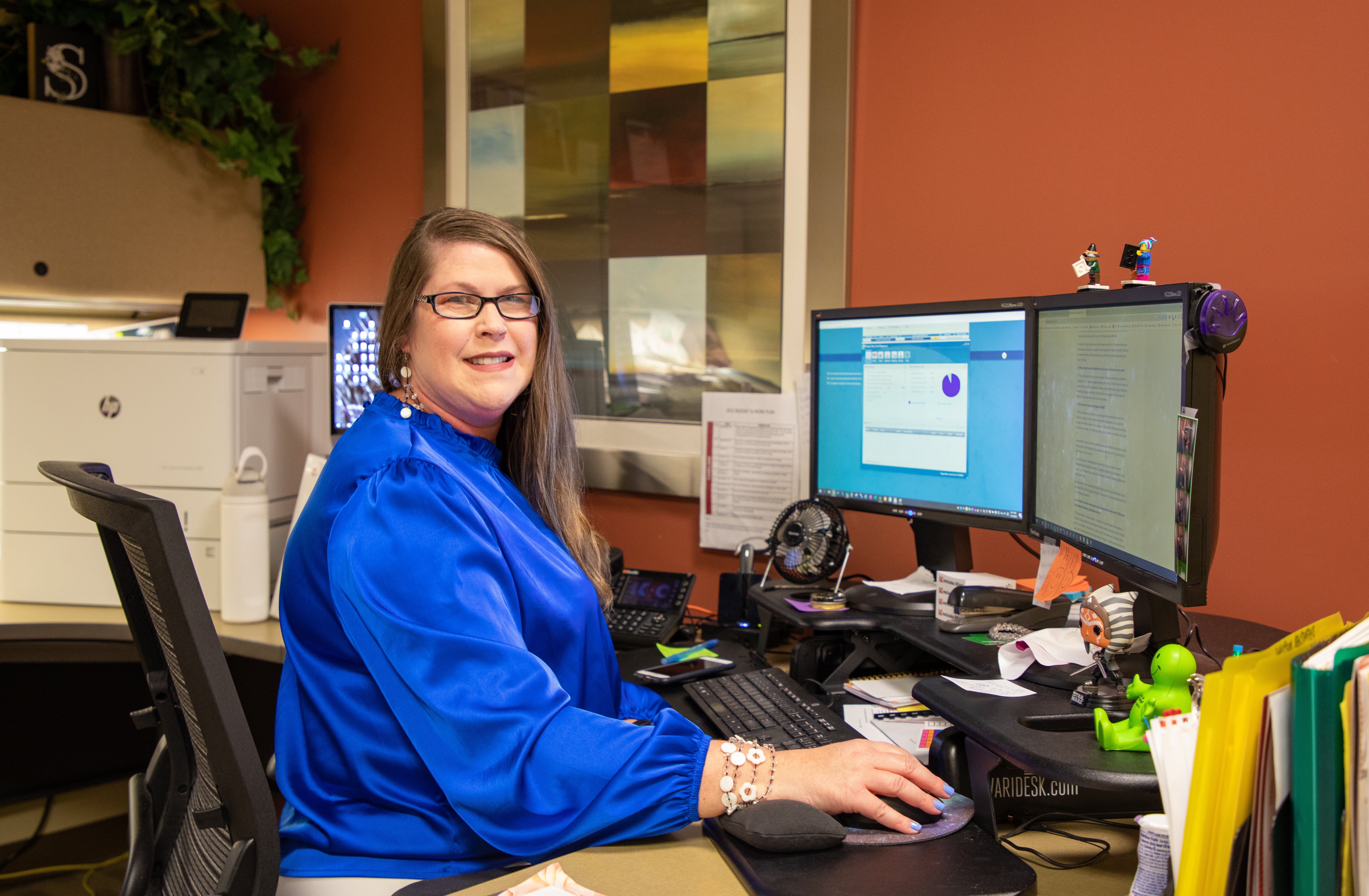 Stephanie Scott working at her desk