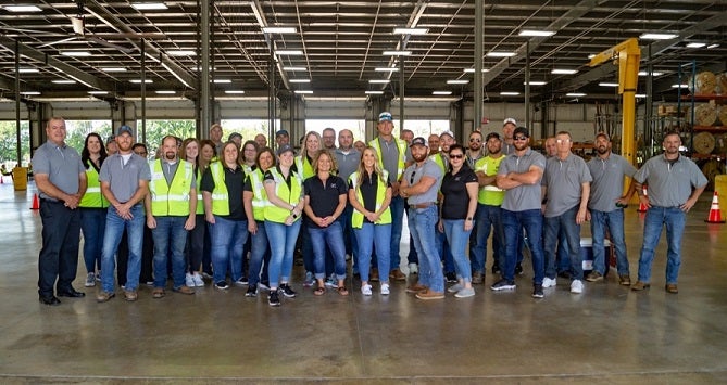 A group photo of the entire KREMC staff at the annual meeting.