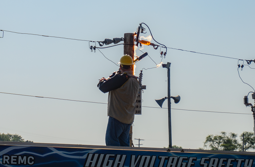 A lineman gives a high-voltage demonstration